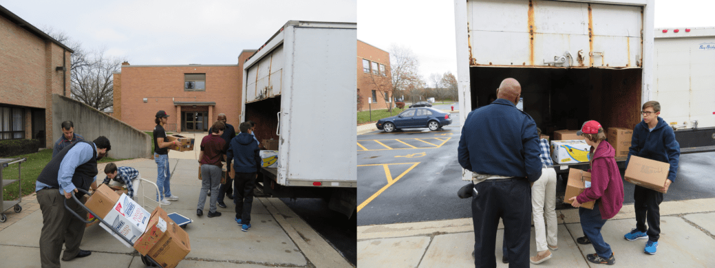 Loading Thanksgiving food drive boxes onto trucks.