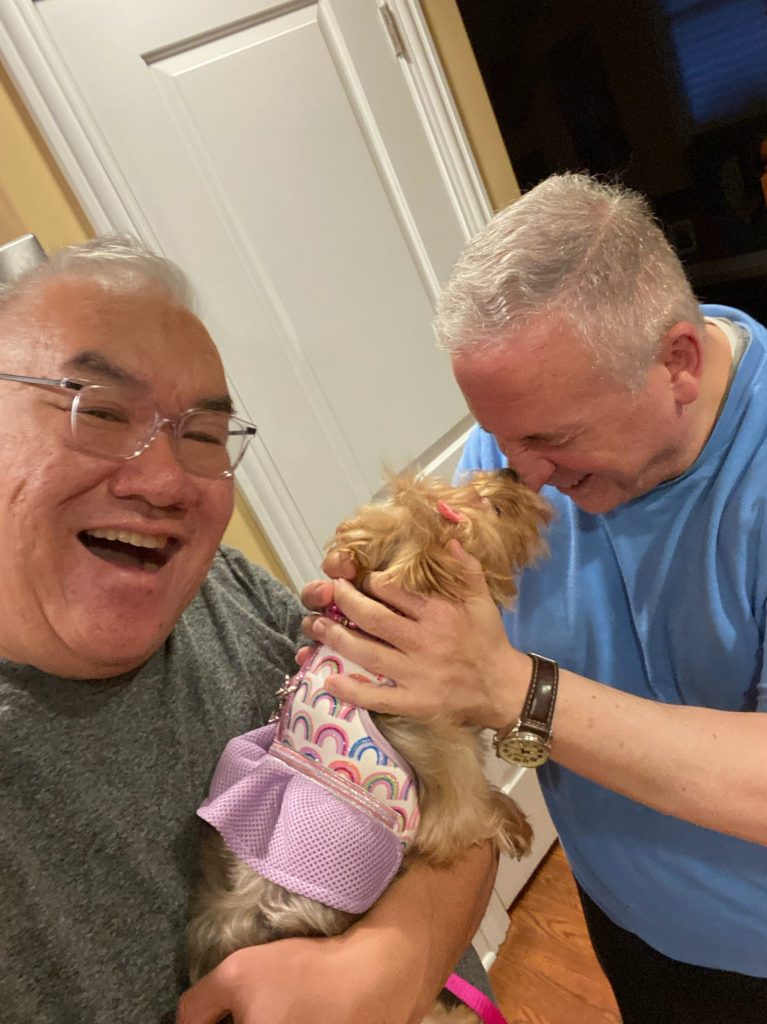 Fr. Sam with Fr. Dindo's dog.
